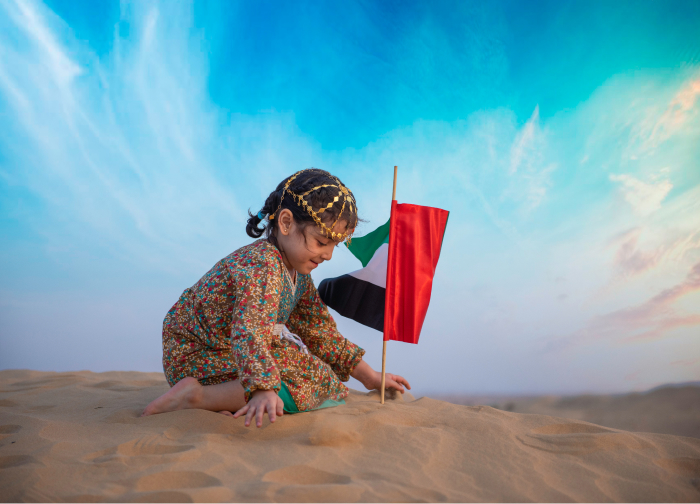 Girl with the flag of UAE. How to relocate to Europe from the UAE?